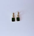 Green crystal earrings.