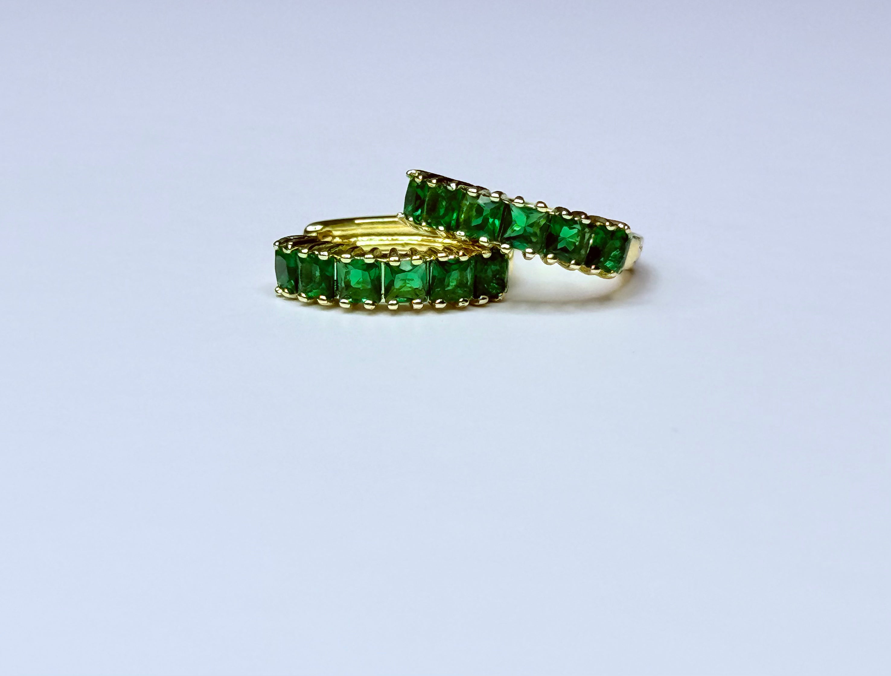 Earrings with green cubic zirconia.