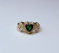Green heart ring with cubic zirconia.