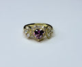 Violet heart ring with cubic zirconia.