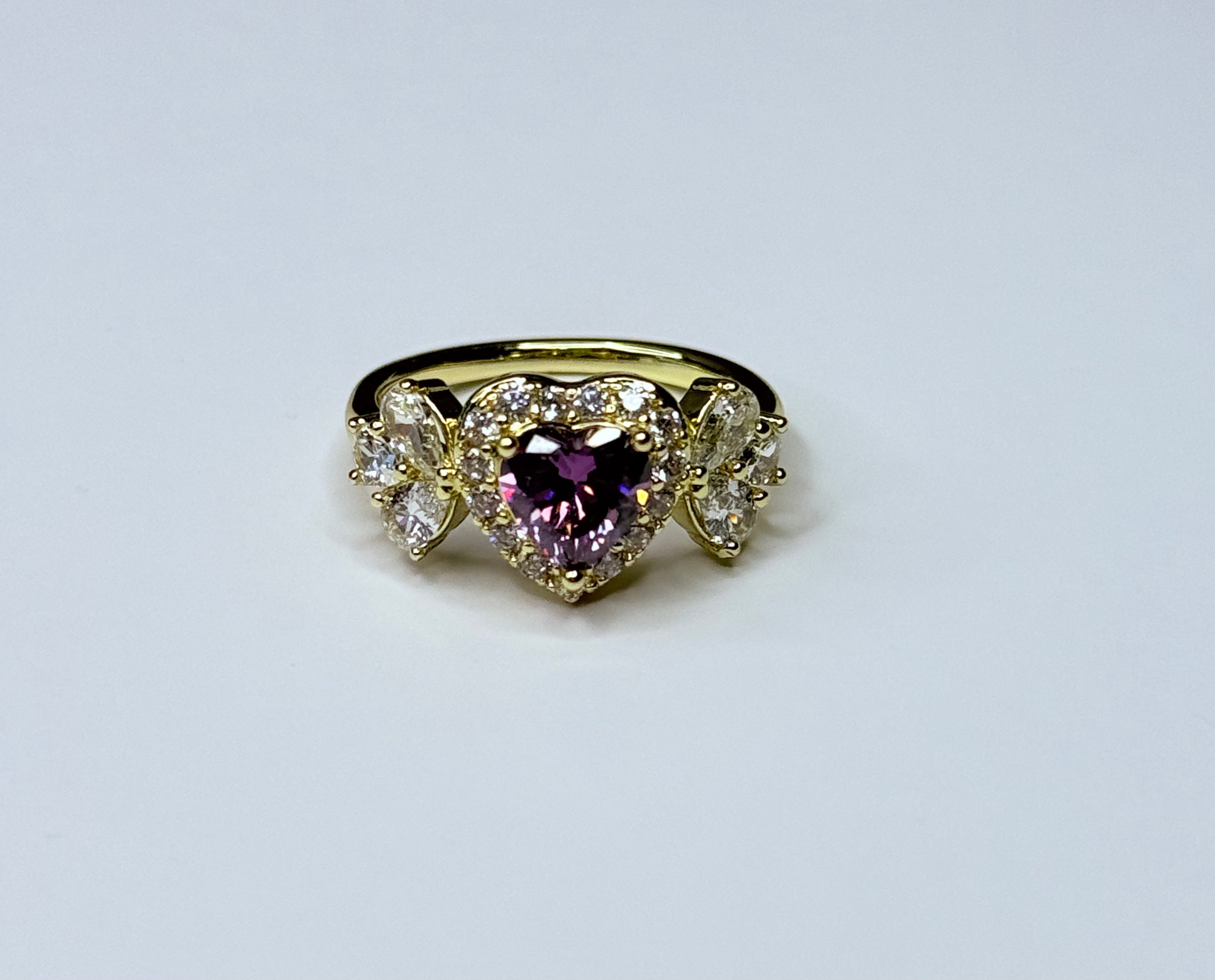 Violet heart ring with cubic zirconia.