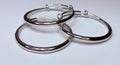 Silver bangle trio.