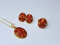 Set featuring genuine carnelian chips and amber and red cubic zirconia.