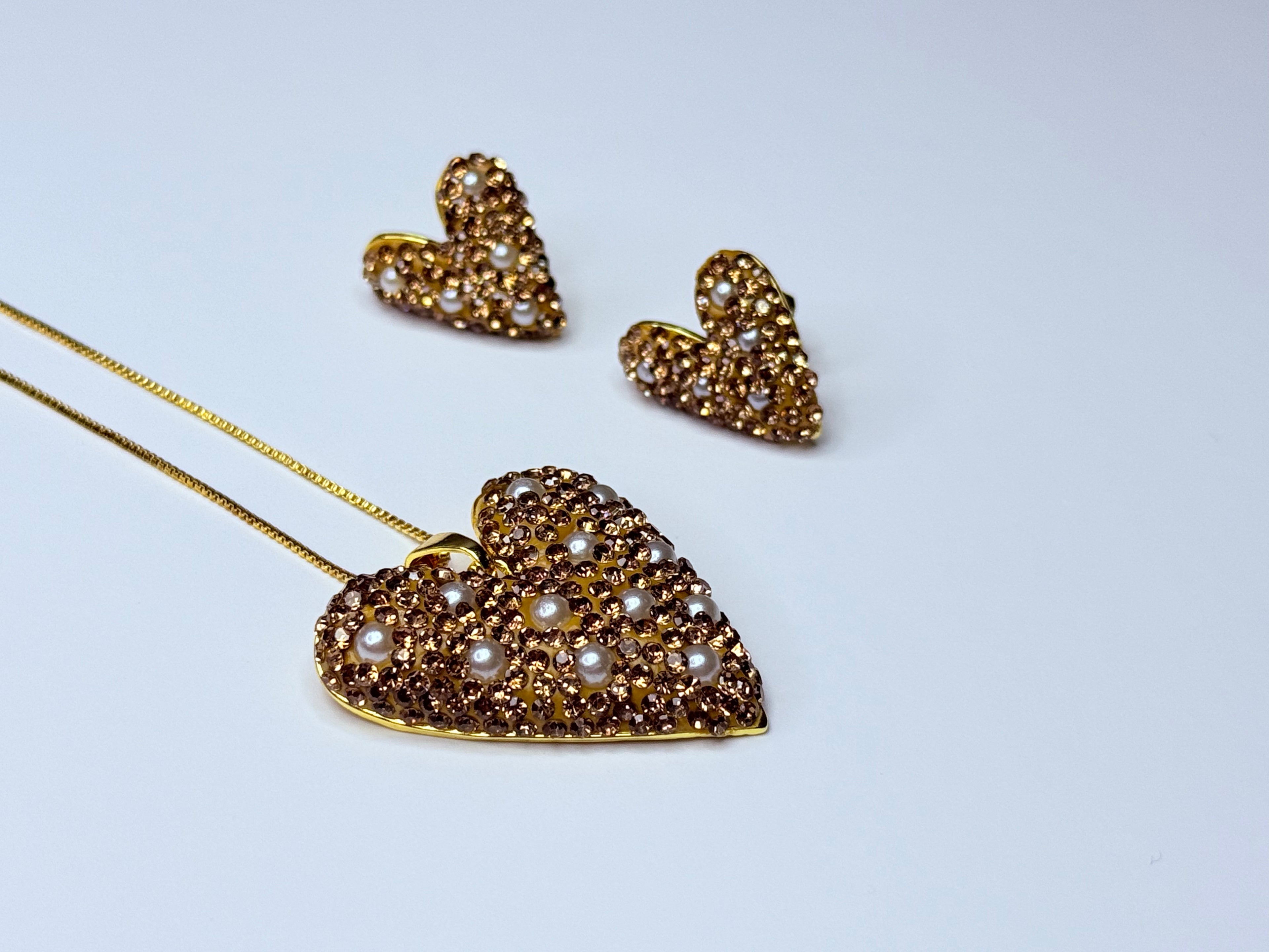 Set of genuine pearls covered in amber-colored cubic zirconia.