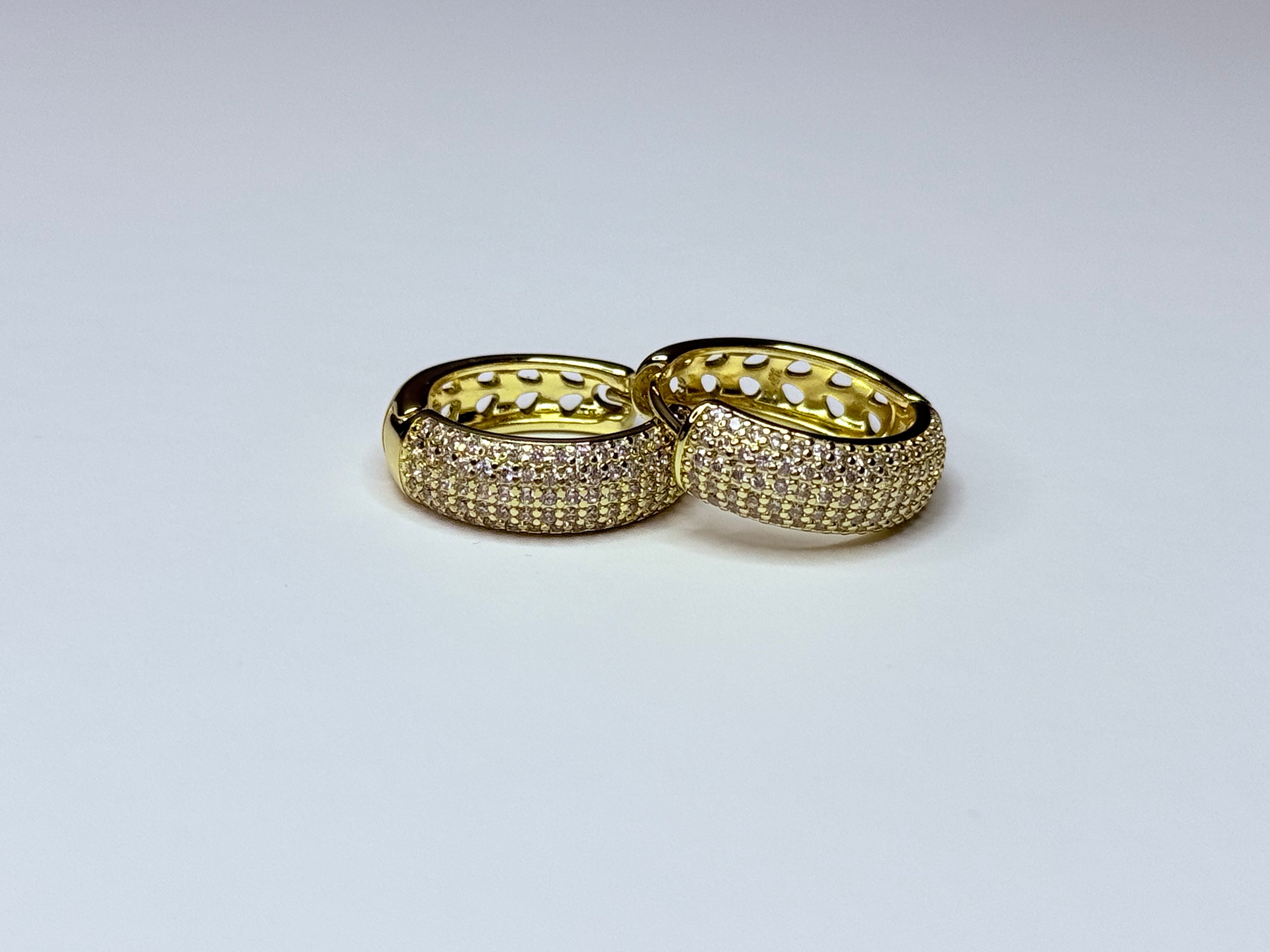 Gold earrings with cubic zirconia.