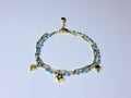 Paperclip bracelet with blue beads.