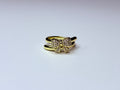 Gold bow ring.