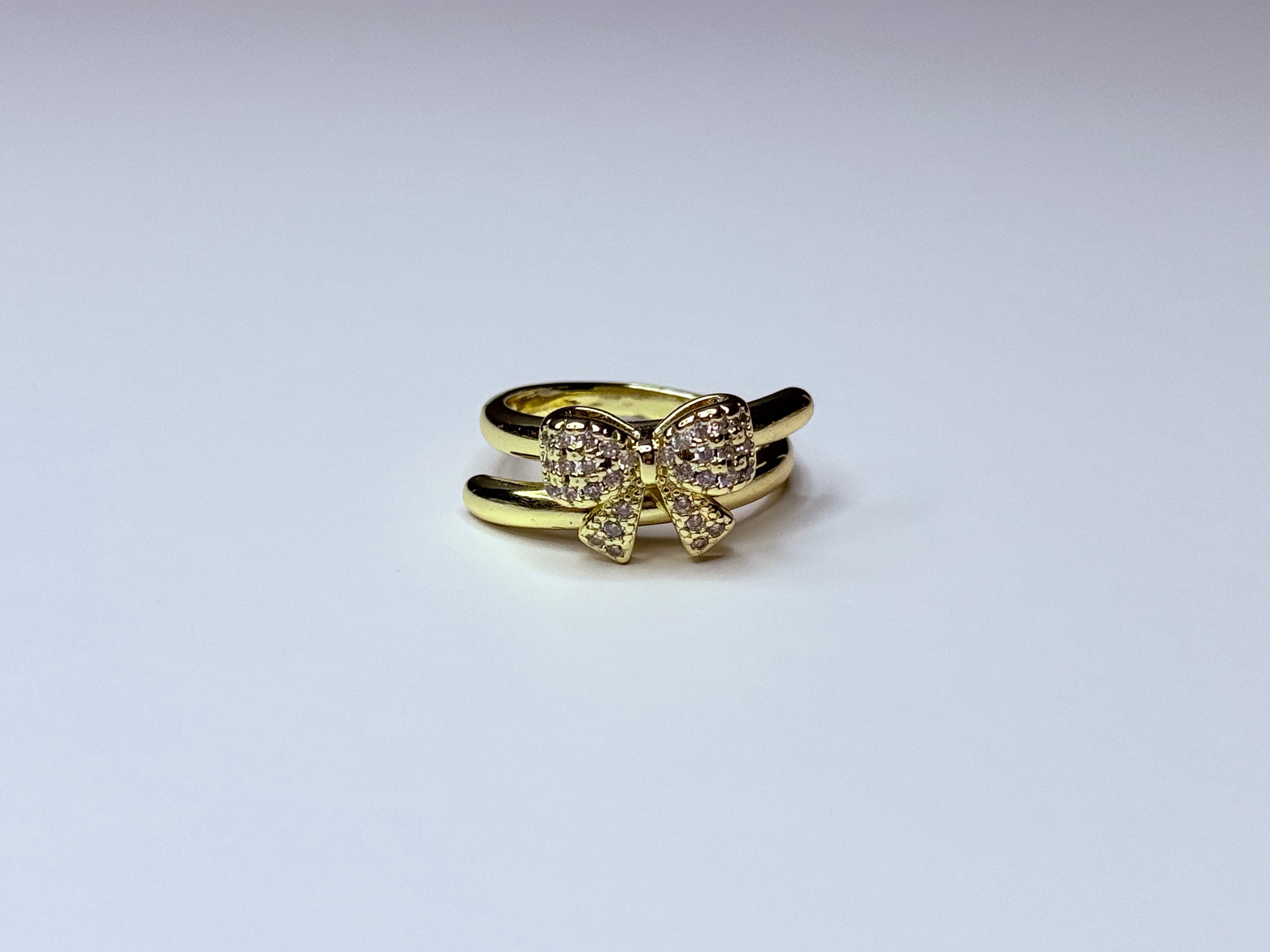 Gold bow ring.