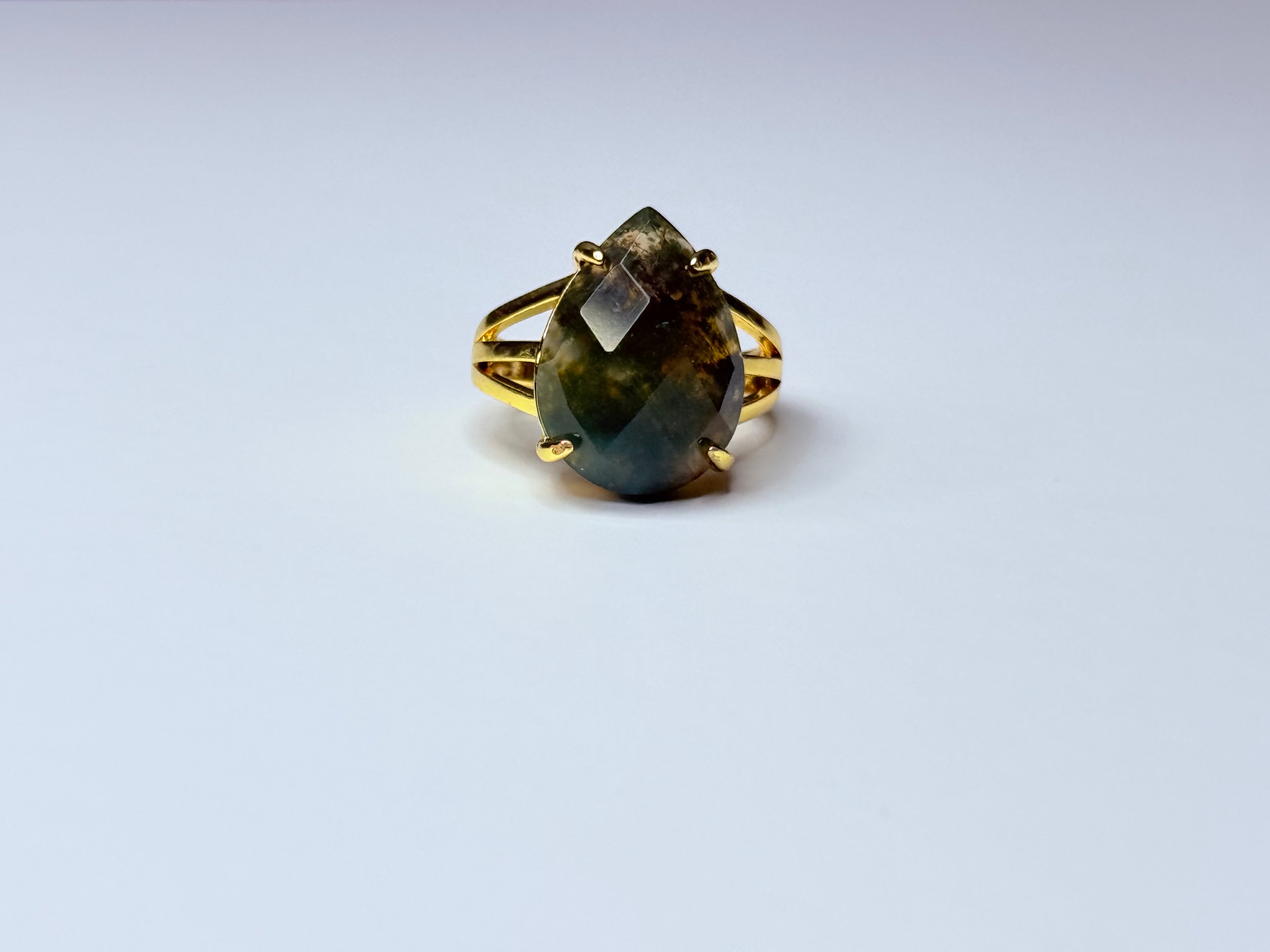 Adjustable moss agate ring.