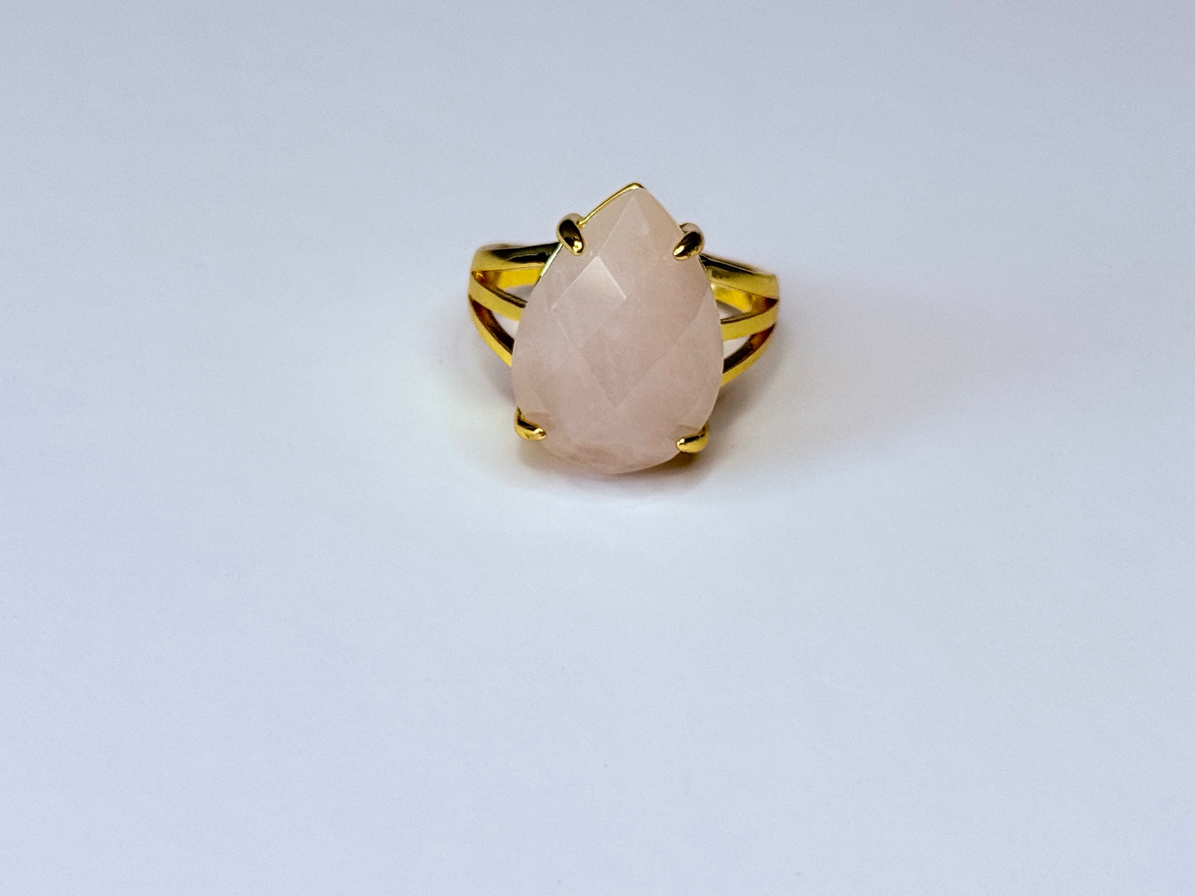 Adjustable rose quartz ring.
