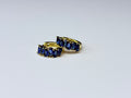 Earrings with navy blue cubic zirconia.