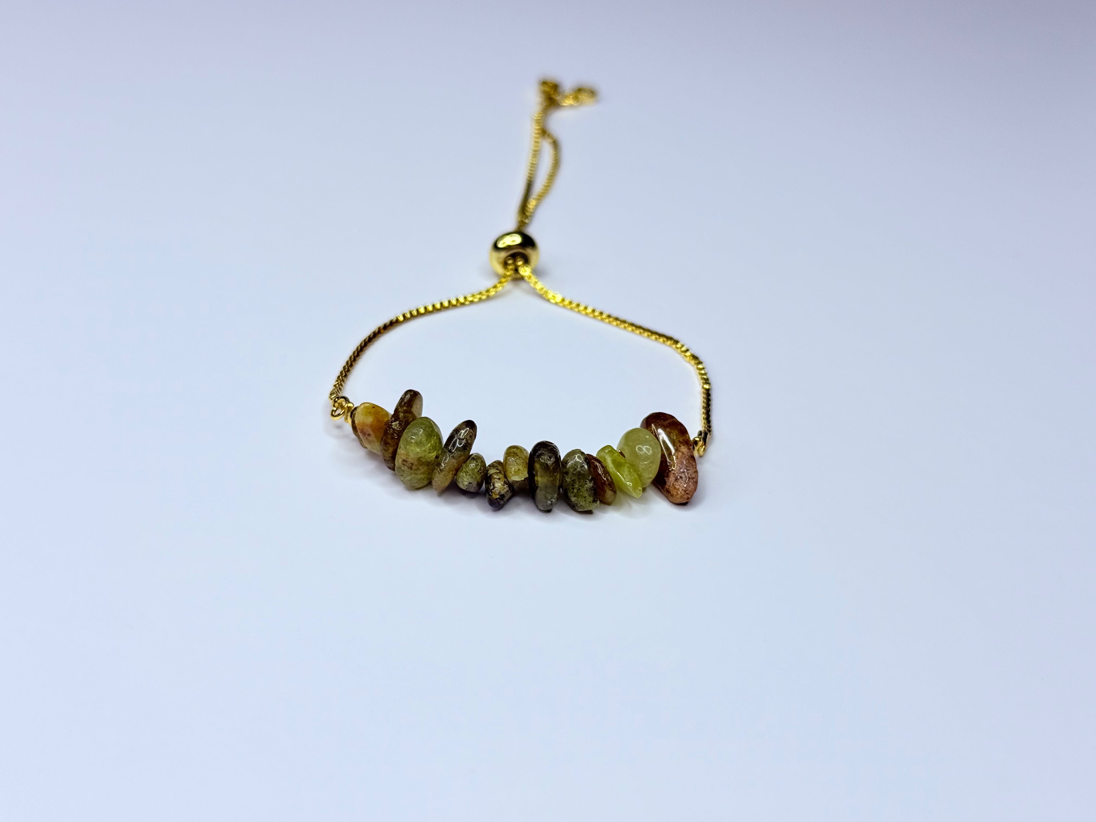 Adjustable genuine stone unakite bracelet.
