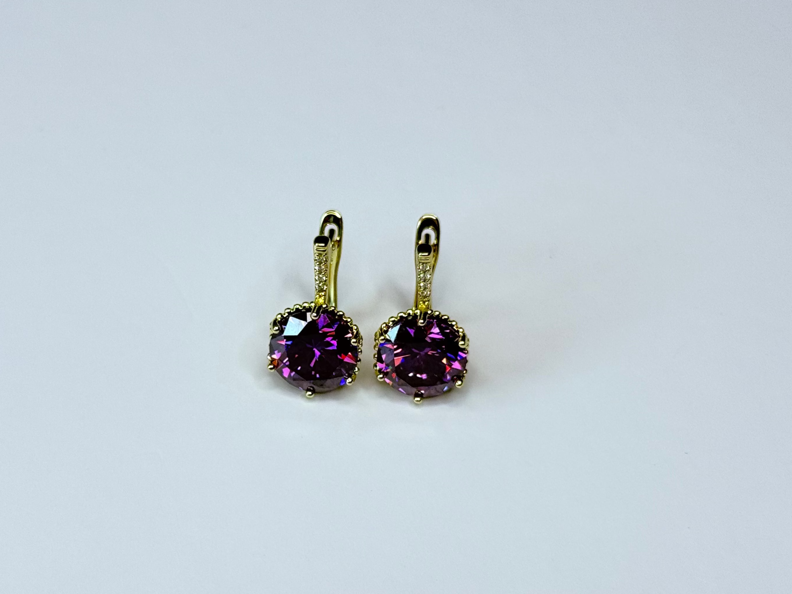 Violet clear crystal earrings.