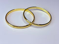 Thin gold bangles.