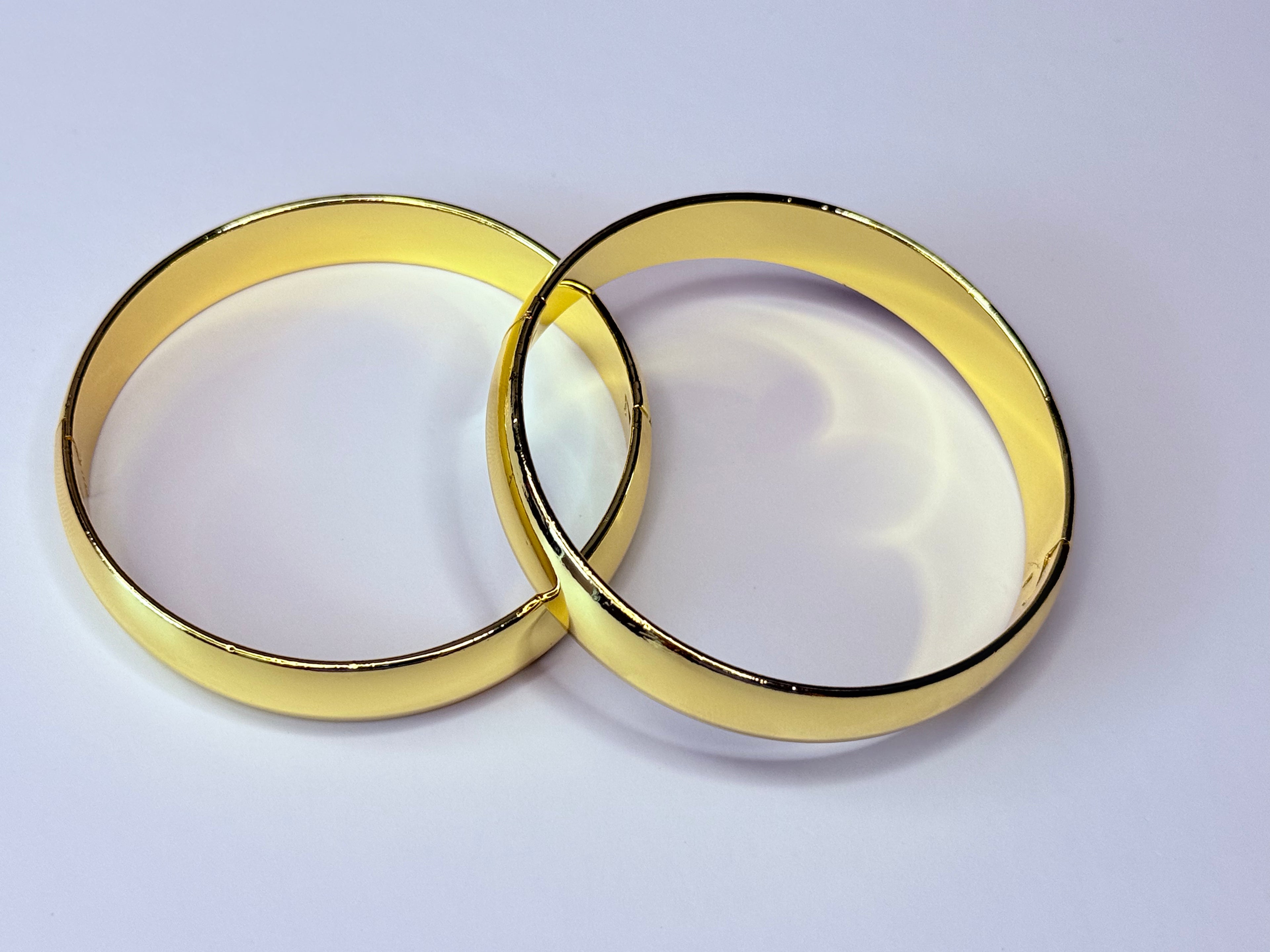 Chunky gold bangles.