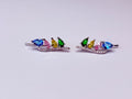 Multicolor silver-tone earring.