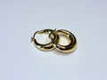 Chunky gold earrings.